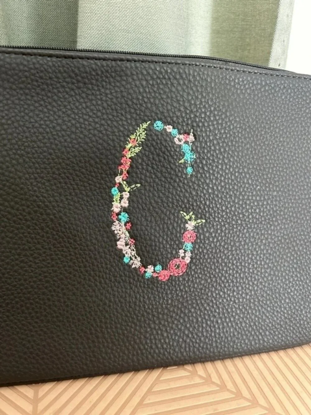Thirty-one Wristlet bag embroidered with a floral “C”